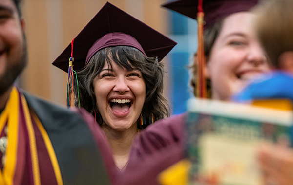 ASU graduate with rainbow tassels